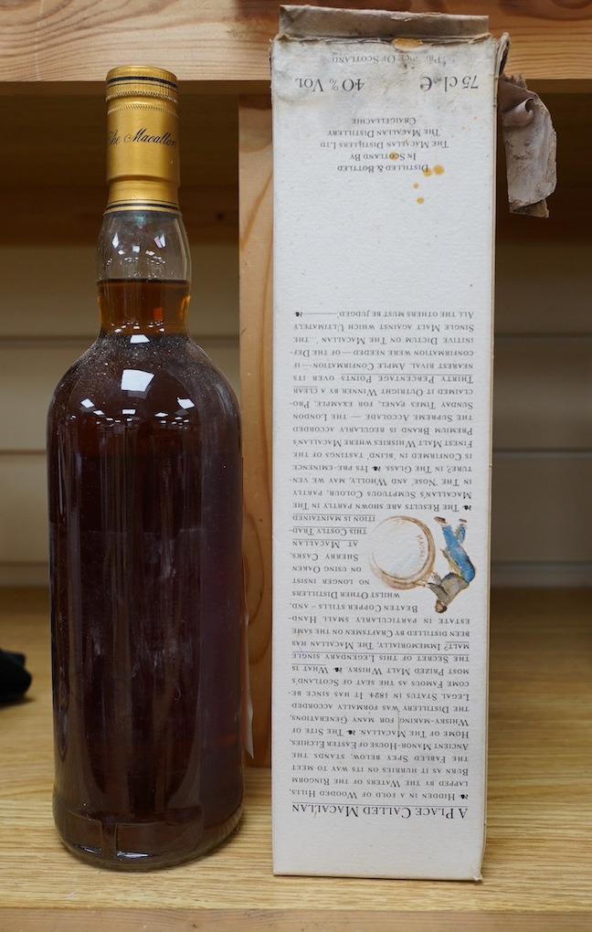 A bottle of The Macallan Single Highland Malt Scotch Whisky, 10 years old, with the remains of its original box. Condition - fair, the label on the bottle is starting to peel off and the box is in poor condition